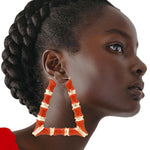 Load image into Gallery viewer, Orange Trapozoid Bamboo Hoops
