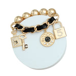Load image into Gallery viewer, Black &amp; Gold Glam: 5 Charm Bracelet
